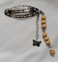 Handmade silver filigree hair clip with natural wood bead strand and silver butterfly charm drop